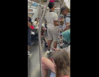 Guy carries snake and another makes sounds