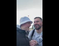 Guy asks football players for picture video