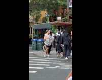 Men dressed as nuns shame man with sign