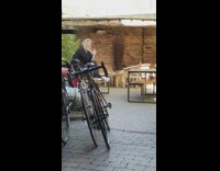 Blondes setting up self timer drop phone