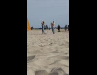 Girl jeans look at fish kite beach