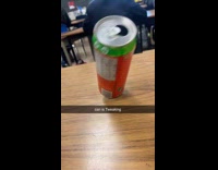 Empty soda can tilted on the table