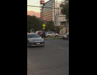 White Helmet Guy Paddleboards Down Street