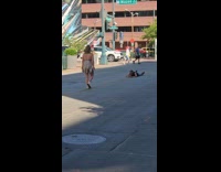 Collab IITW - Woman shiny dress walks middle of street