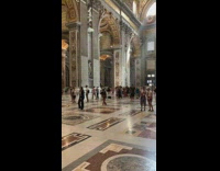 Woman in crop top models inside the church