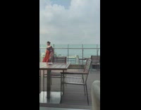 Woman long dress pose at building rooftop