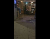 Girl poses white canopy restaurant patio flash 