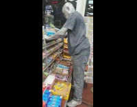 Guy painted metallic silver at liquor store 