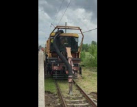 Maintenance vehicle vacuum clean the train tracks