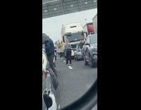 Girls get out in stopped traffic 