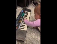 Baby plays key randomly and produces music 