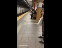 Boy blue jacket sticks entire hand in his mouth at subway station