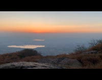 Timelapse of sunrise on peak of hill