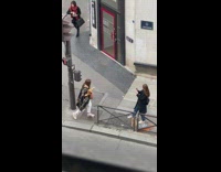 Lady Pose on Stoplight as she Holds Baguettes 
