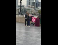Green skirt girl sits wall river bridge 