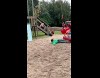 Girl swinging on ball rope swing falls 