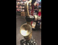 Statue of floating head guy with saxophone 