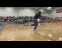 Guy runs to pop balloon on girl 