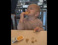 Boy falls asleep eats french fry