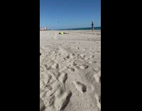 Man lie down on the sand with aerial drone