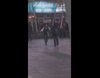 Fashionable Lady Dances and Sings on Walkway