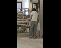 Guy white shirt take pictures sourdough bread