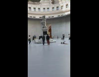 Girl scarf boots step forward statue museum