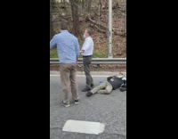 People get out to help injured motorcyclist 