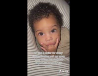 Baby Sucks its Fingers as it Lays