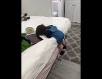 Toddler fell asleep halfway climbing up bed 