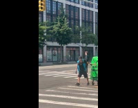 Guy black jacket spin dance at crosswalk