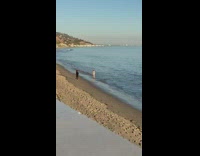 Woman black bikini walk on beach