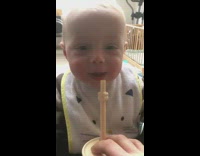 Baby sip and spit out water laughs