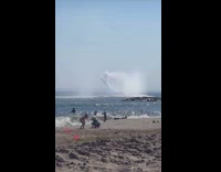 Collab WINY - Boat drives around beach shoots water air