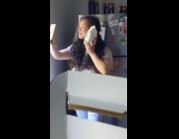 Woman takes a selfie with free cookies she won