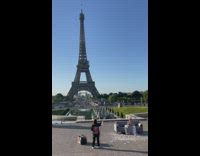 Woman in dress on a couch bubbles and Eiffel Tower
