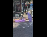 Purple plastic kiddie pool broken fire hydrant 