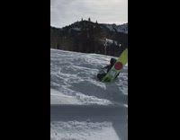 Guy frontflips in GNU snowboard and fails 