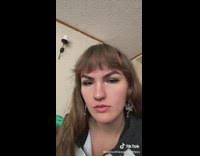 Woman filming herself taking a bite of fruit but dentures come off 
