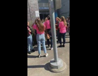 People lined for the wings painting on the wall