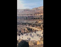 Family visits colosseum in Rome for vacation