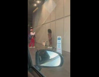 Woman in underwear pose at parking entrance