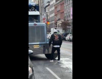 Man eagle print jacket dance in front of truck