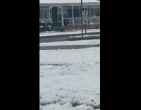 Girl films tiktok dance in snow with shorts