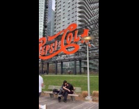 Woman sword dancing and couple on bench