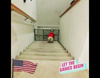 Dog jumps over gate bottom of stairs