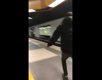 Guy loses skateboard onto subway train tracks