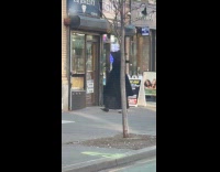 Person black robe nun outfit walk street