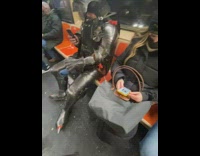 Guy on subway wearing metal armor