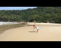 Guy does tricks on beach sand
